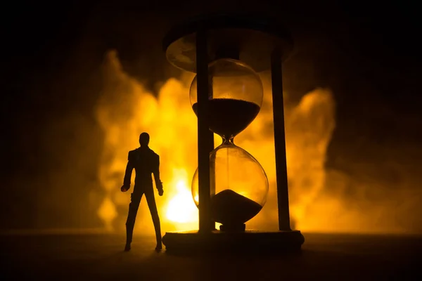 Time Concept Silhouette Man Standing Big Hourglass Smoke Lights Dark — Stock Photo, Image