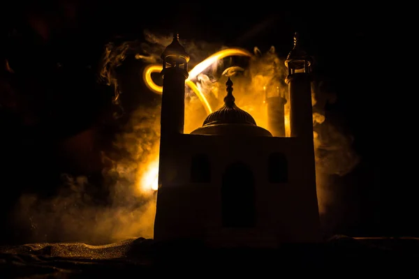 A realistic Mosque miniature with windows at night. Festive greeting card, invitation for Muslim holy month Ramadan Kareem. Selective focus