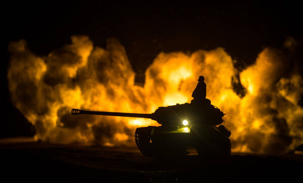 War Concept. Military silhouettes fighting scene on war fog sky background, World War Soldiers Silhouette Below Cloudy Skyline At night. Tank battle. Selective focus