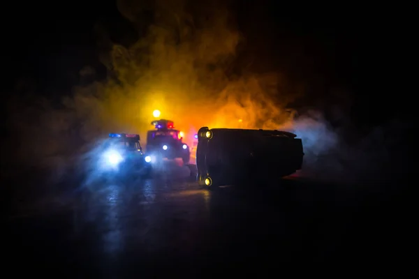 Police car chasing a car at night with fog background. 911 Emergency response police car speeding to scene of crime. Selective focus