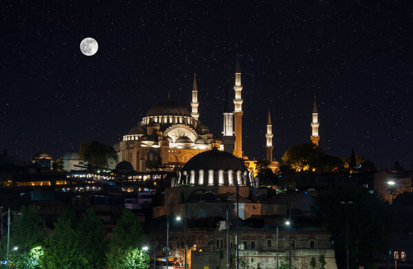 Night lights on Hagia Sophia under a full moon at twilight in Istanbul Turkey. Long exposure shot.
