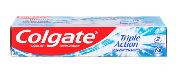 stock image Moscow, Russia - March 27, 2021: Colgate Triple Action Extra Whitening toothpaste with calcium and fluoride in cardboard packaging isolated on white background