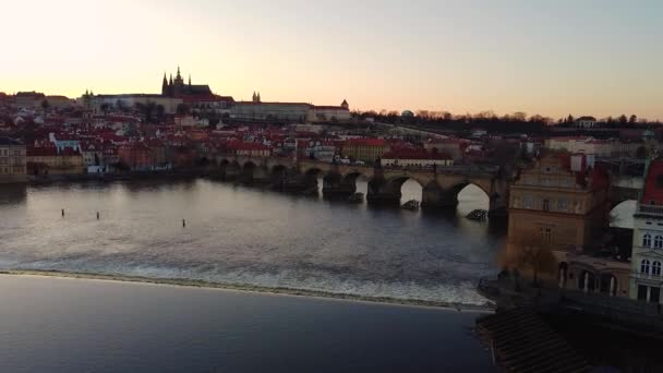 Aerial view of Prague Old Town architecture and Charles Bridge over Vltava river at sunset. Old Town of Prague, Czech Republic. — Stock Video