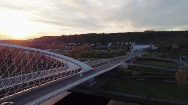 Aerial top view of modern bridge with riding cars over the River Vltava at Prague. — Stock Video