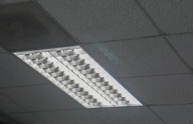 LED light on the office ceiling for lighting in working hour clipart