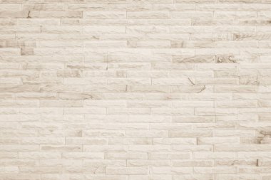 Geniş krem tuğla duvar dokusunun arka planı. Eski kahverengi tuğlalı beton duvar desenli duvar, duvar kağıdı kireç taşı soyut döşeme / Sistem düzensiz iç kaya. Ev ya da ofis tasarımı arka planı. Yatay mimari duvar kağıdı. Eski tuğla duvar boş