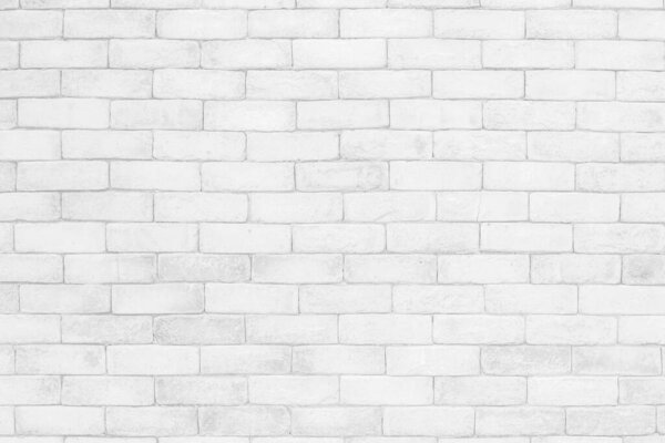 Empty white brick wall. White brick wall texture background in room at subway. Brickwork stonework interior, Clean concrete uneven abstract weathered bricks tile design, Horizontal architecture wallpaper. Aged paint white brick wall background