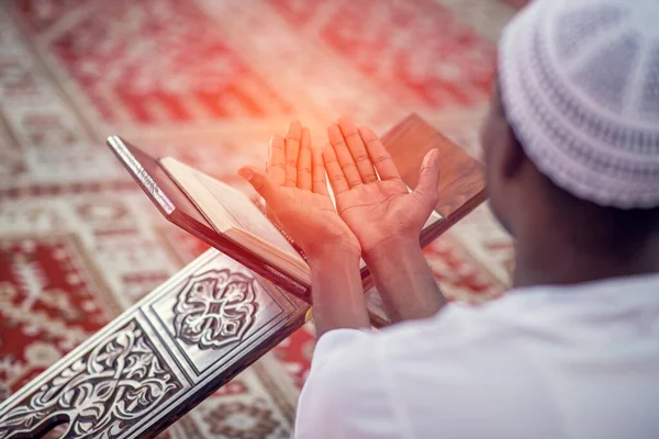 Religious black muslim man praying inside the mosque — Stock Photo, Image