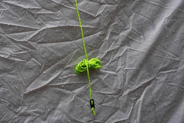 Green Rope Attaching Tourist Tent Hangs Gray Awning — Stock Photo, Image