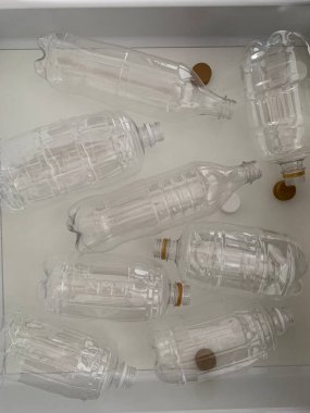 Transparent plastic bottles in a drawer top view