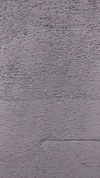 Szczegółowa tekstura tynku ulicznego z nieprawidłowościami — Zdjęcie stockowe