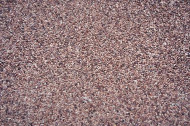 Sıcak renkli mermer kırıntıların dekoratif dış kaplaması.