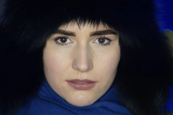 Portrait of a girl in a black winter fur hat close-up — Stock Photo, Image