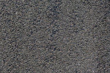 Arka plan olarak asfalt yol dokusu. Üst görünüm.