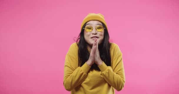 Asian young pretty stylish modern woman in yellow clothes feeling happy and surprised excited standing isolated on pink background with impressed face, lottery winner joyful reaction. Portrait concept — Stockvideo
