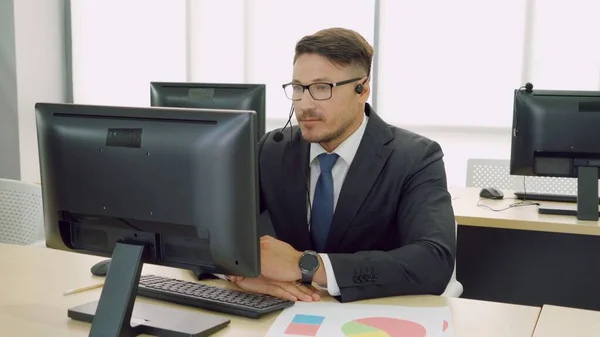 Business people wearing headset working in office — Stock Photo, Image