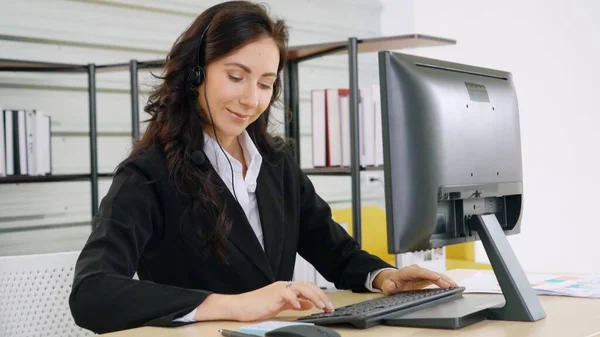 Business people wearing headset working in office — Stock Photo, Image