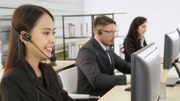 Business people wearing headset working in office