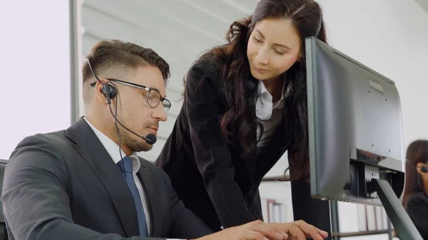 Business people wearing headset working in office — Stock Photo, Image