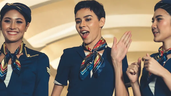 Cabin crew dancing with joy in airplane — Stock Photo, Image