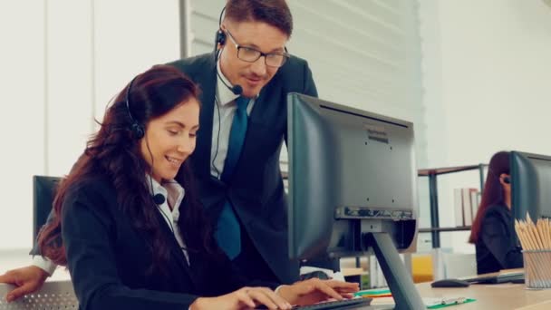 Business people wearing headset working in office — Stock Video