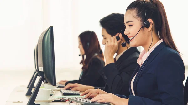 Business people wearing headset working in office — Stock Photo, Image