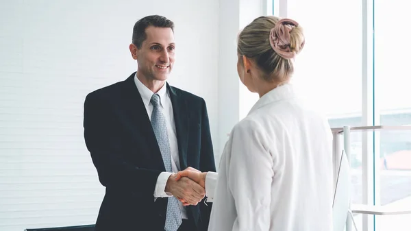 Business people handshake in corporate office — Stock Photo, Image