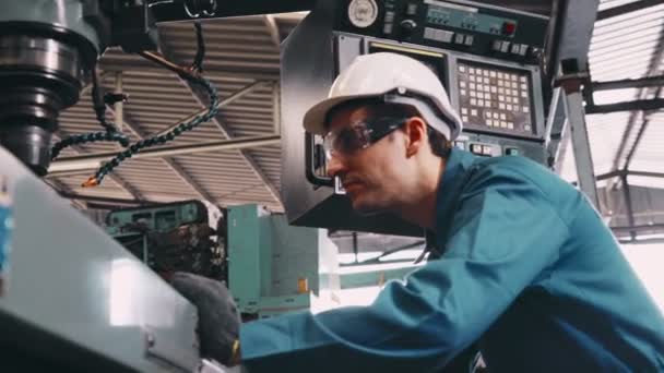 Smart factory worker using machine in factory workshop — Stock video