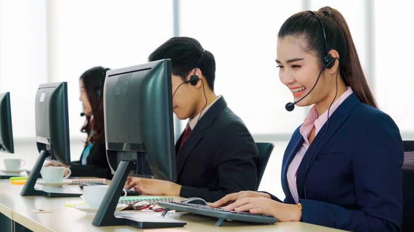 Business people wearing headset working in office — Stock Photo, Image