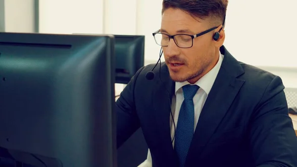 Business people wearing headset working in office — Stock Photo, Image