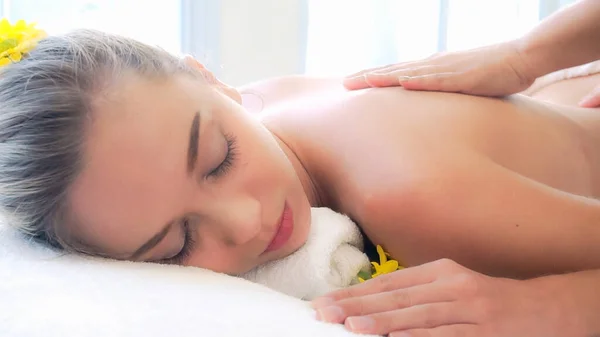 Woman gets back massage spa by massage therapist. — Stock Photo, Image