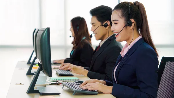 Business people wearing headset working in office — Stock Photo, Image