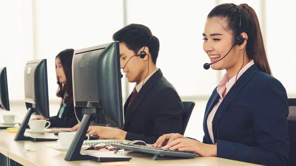 Business people wearing headset working in office — Stock Photo, Image