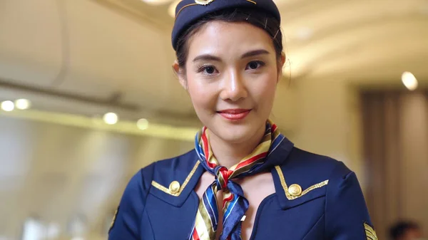 Cabin crew or air hostess working in airplane