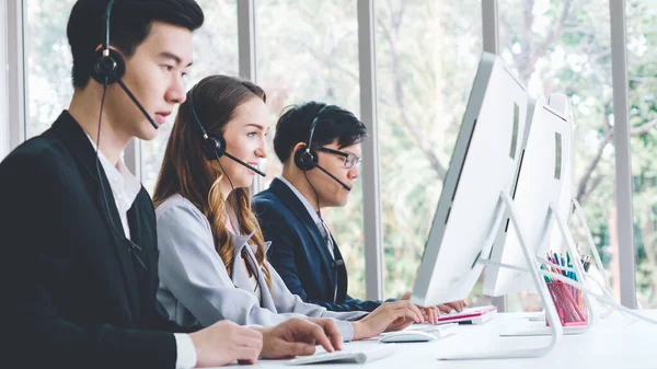 Business people wearing headset working in office — Stock Photo, Image