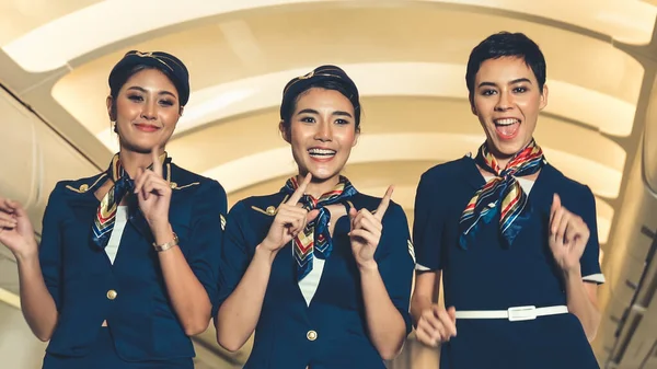 Cabin crew dancing with joy in airplane — Stock Photo, Image