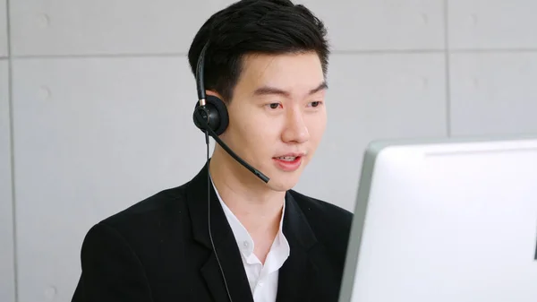 Business people wearing headset working in office