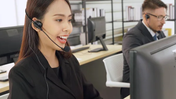 Business people wearing headset working in office — Stock Photo, Image