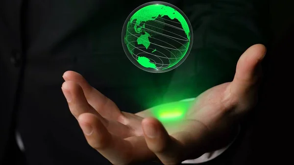 Human hand holding earth globe holographic technology