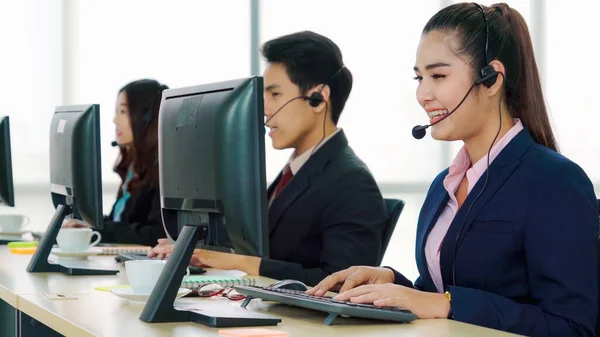 Business people wearing headset working in office