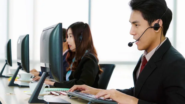 Business people wearing headset working in office — Stock Photo, Image