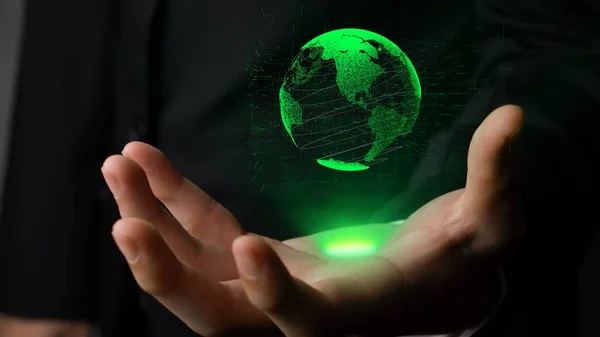 Human hand holding earth globe holographic technology