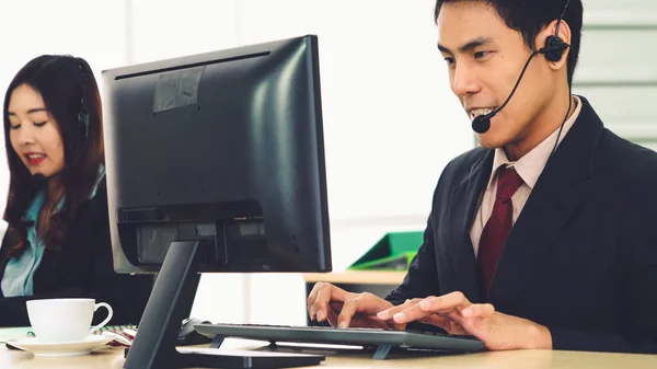 Business people wearing headset working in office