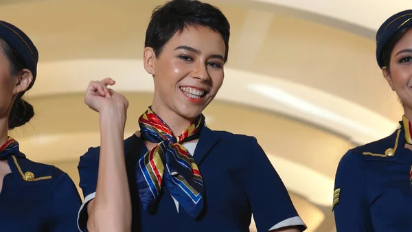 Cabin crew dancing with joy in airplane — Stock Photo, Image