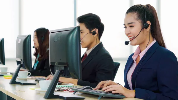 Business people wearing headset working in office — Stock Photo, Image