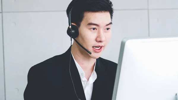 Business people wearing headset working in office — Stock Photo, Image