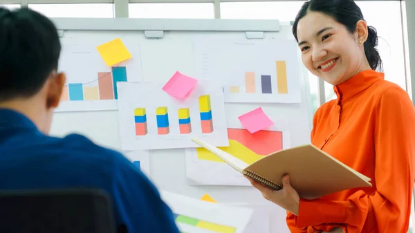 Young woman explains business data on white board — Stock Photo, Image