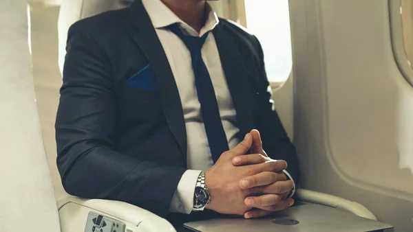 Businessman travel on a business trip by airplane