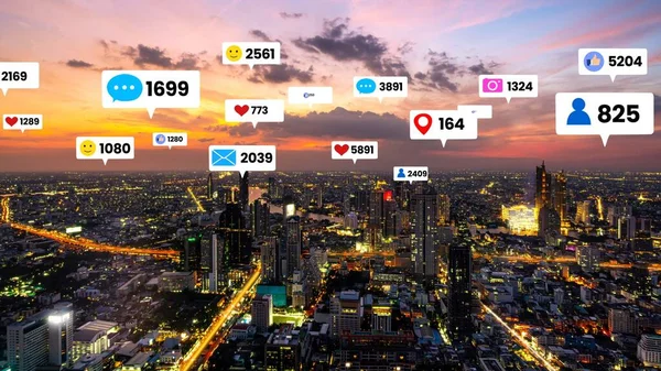 Social media icons fly over city downtown showing people engagement connection