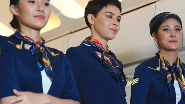 Cabin crew dancing with joy in airplane — Stock Photo, Image